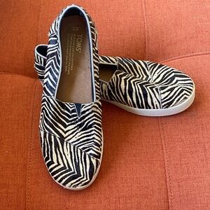 TOMS Black and White Zebra Pattern Slip-Ons